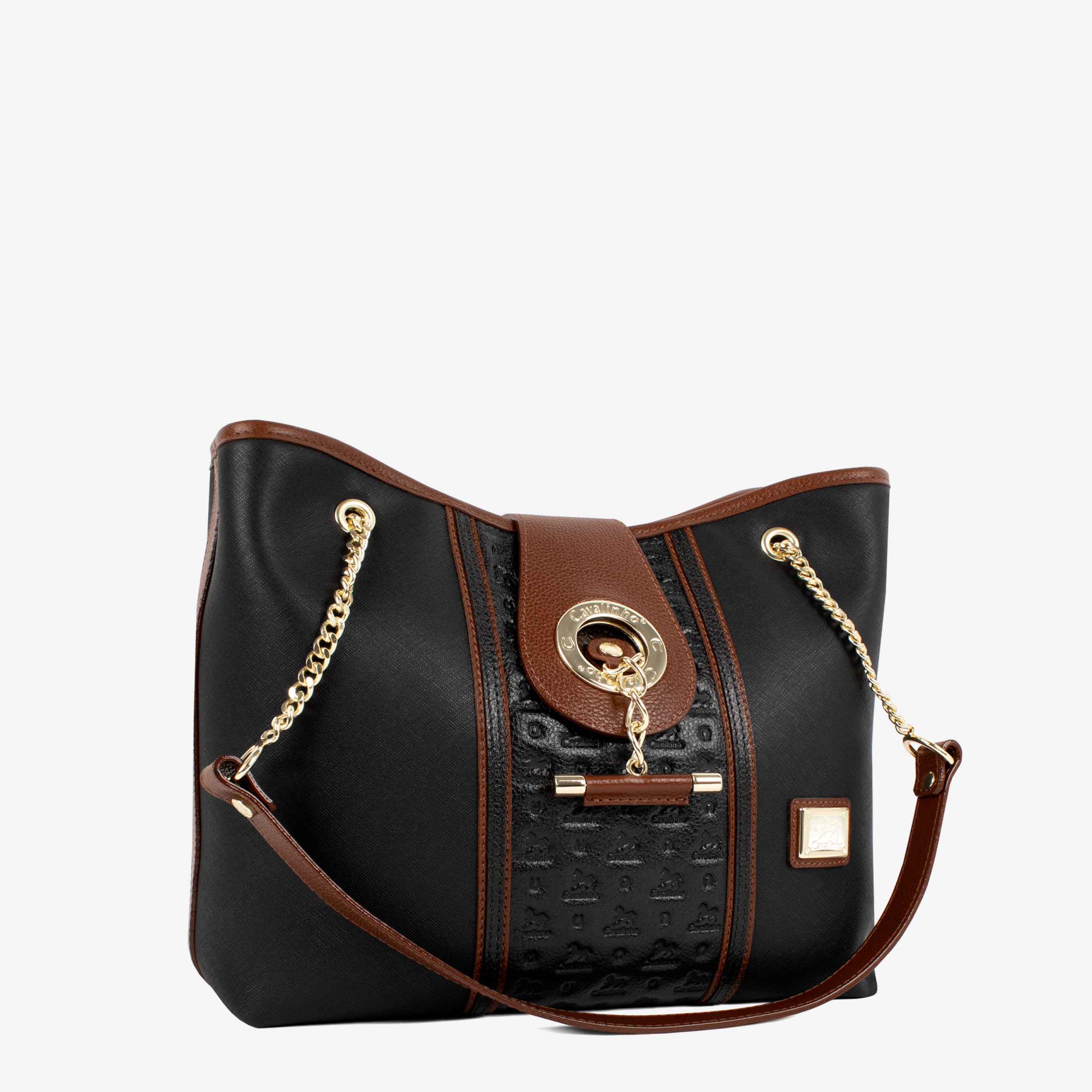 Mala Ombro Cavalinho Origem Esta mala de ombro é o acessório ideal para a mulher que busca combinar elegância intemporal com uma funcionalidade superior. Perfeita para o ambiente de trabalho, eventos sociais ou para o dia a dia. Desenhada para otimizar a sua organização e facilitar o acesso aos seus pertences.