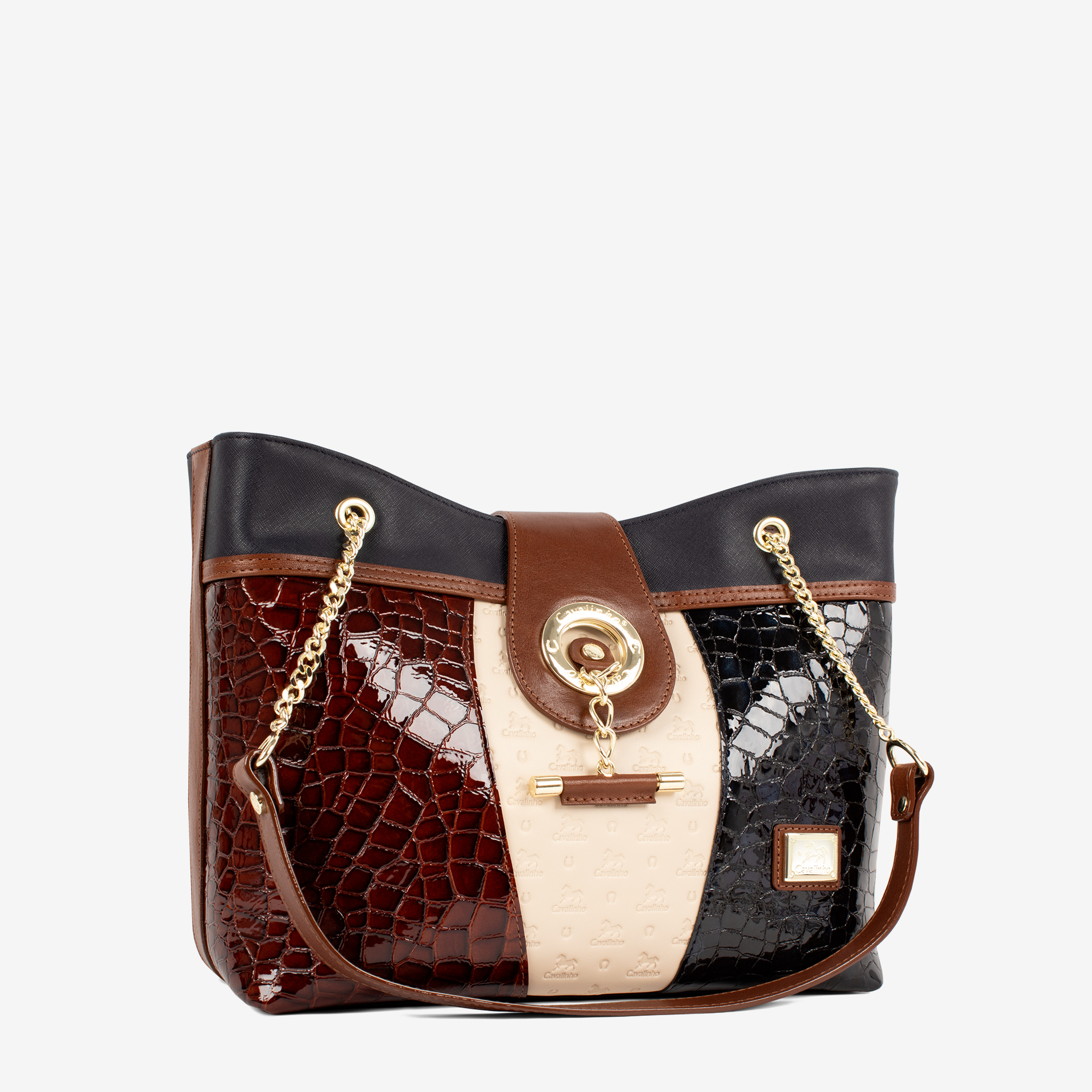 Mala Ombro Cavalinho Essência Esta mala de ombro é o acessório ideal para a mulher que busca combinar elegância intemporal com uma funcionalidade superior. Perfeita para o ambiente de trabalho, eventos sociais ou para o dia a dia. Desenhada para otimizar a sua organização e facilitar o acesso aos seus pertences.